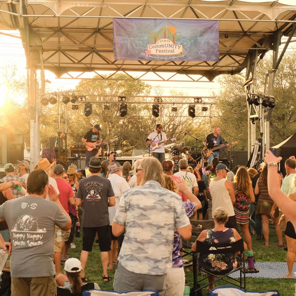Crowd enjoying live music at golden hour